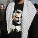 An Iranian resident wearing a t-shirt with the face of slain Quds Force commander Qassem Soleimani at a protest in Tehran on Jan 3., 2020.